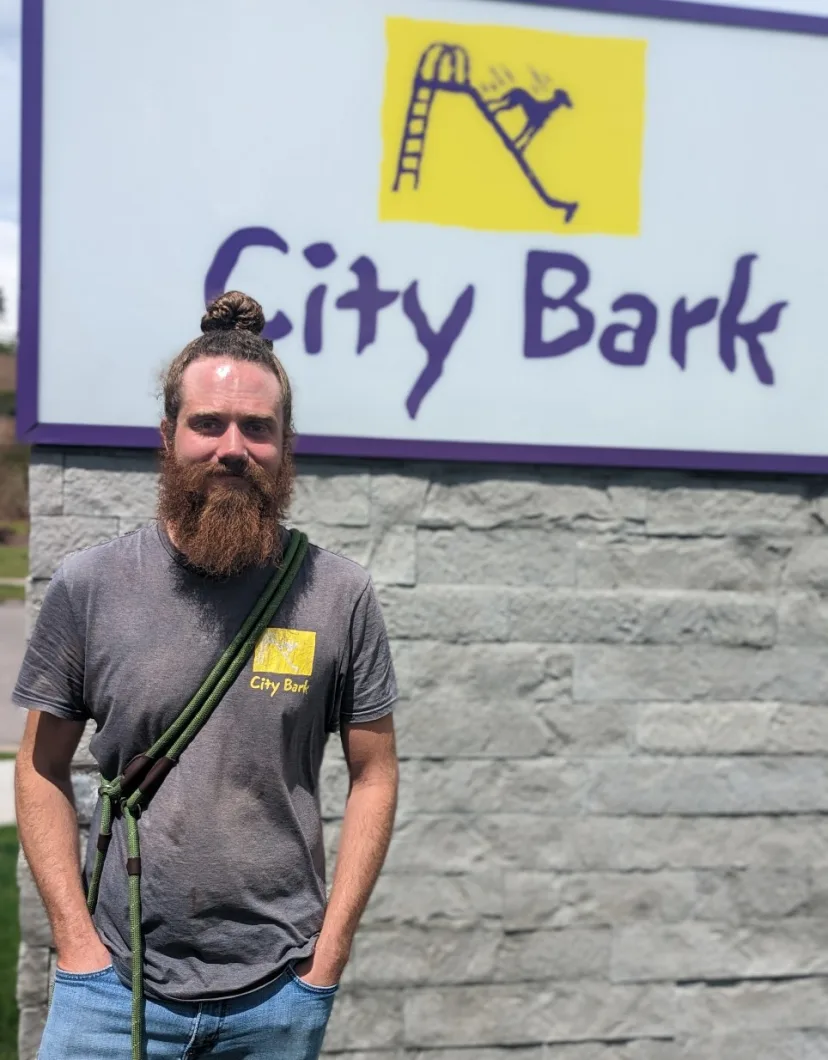 Hunter Cain standing outside in front of City Bark sign